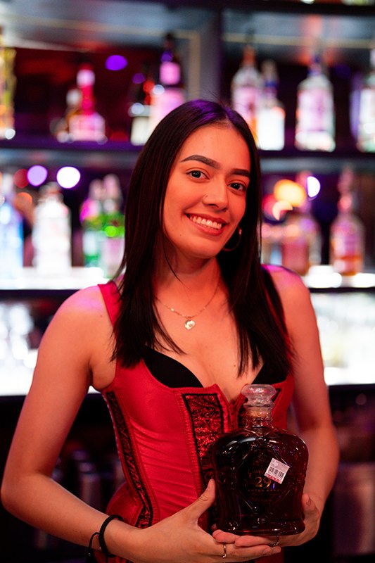 Smiling server in red corset